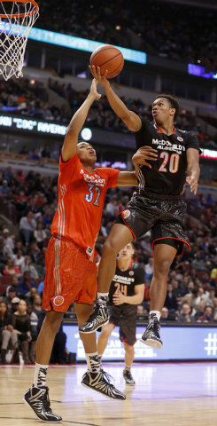 McDonald’s West All-American Rashad Vaughn (20) shoots over McDonald’s East All- ...