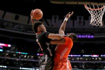 McDonald’s West All-American Kelly Oubre, left, goes up for a dunk but is fouled by Mc ...