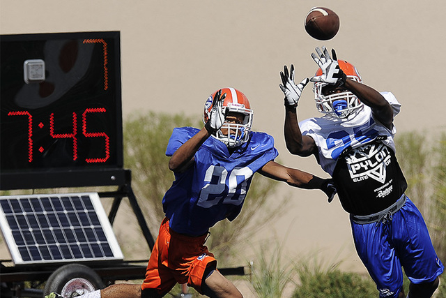 Bishop Gorman wide receiver Tyjon Lindsey, right, goes for a catch while cornerback Jabari B ...