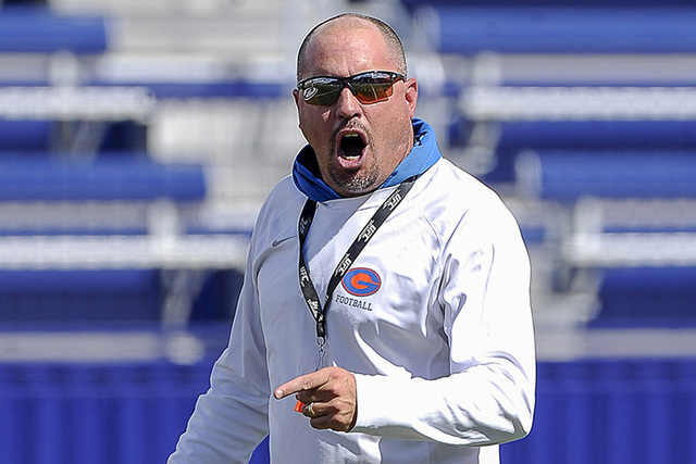 Coach Tony Sanchez gives instruction during practice on Wednesday. Sanchez runs an intense, ...