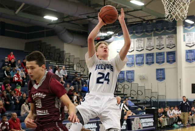 Centennial forward Garett Scheer (24) goes up for a shot past Cimarron-Memorial guard Austin ...