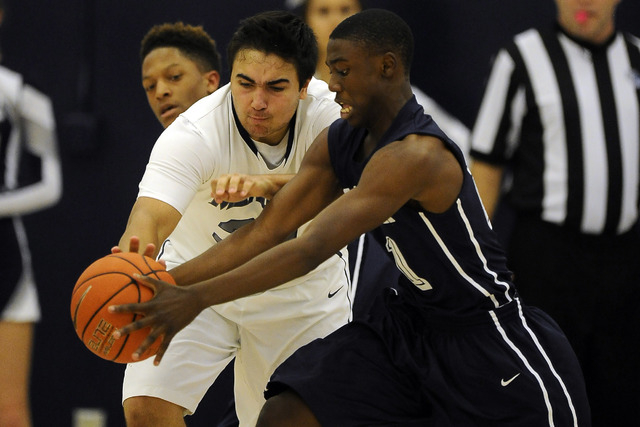 The Meadows School center Alex Agrawal, left, and Agassi Prep guard Cajon Lakes battle for a ...