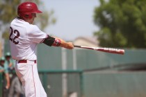 Desert Oasis senior Nolan Kingham swings to hit a home run during a baseball game against Gr ...