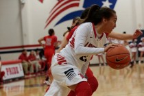 Liberty’s Kaily Kaimikaua (21) handles the ball Monday in a home game against Arbor Vi ...