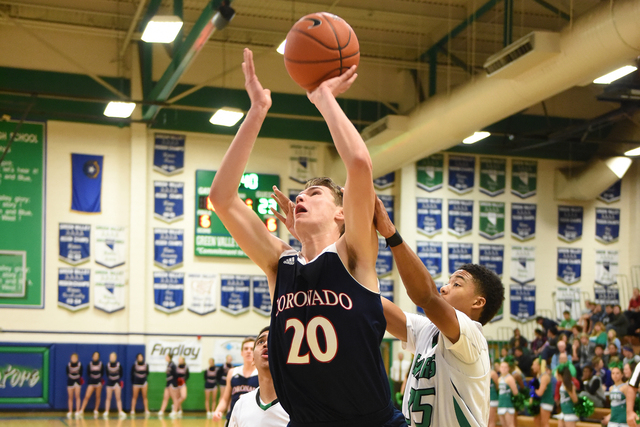 Coronado’s Nick Kornieck (20) shoots the ball against Green Valley’s Kelvin Omoj ...