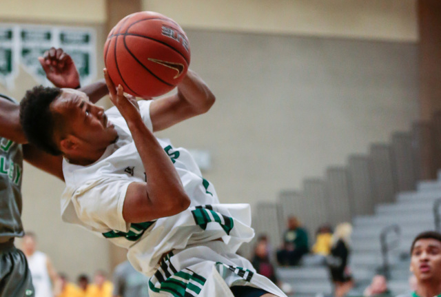 Rancho High School’s David McKeever (1) maneuvers up and around to take a shot in a ga ...