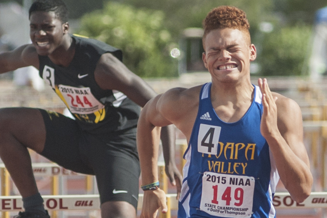 Moapa Valley’s R.J. Hubert finishes the D1 110-meter hurdles in first place during the ...