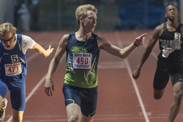 Green Valley High School’s Ian Mack celebrates as he finishes first in the D1 200-mete ...