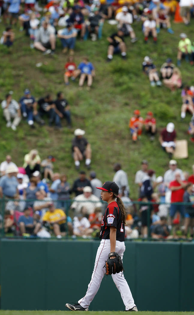Canadas Emma March paces at her position during the second inning of an international pool play ...