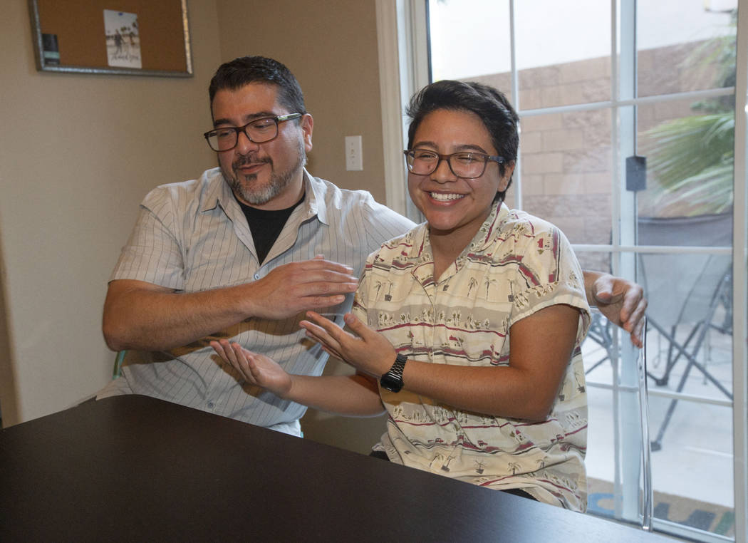 Albert Neavez and his son, Percy, reach in for a hug on July 1, 2019, in Henderson. (Michael Bl ...