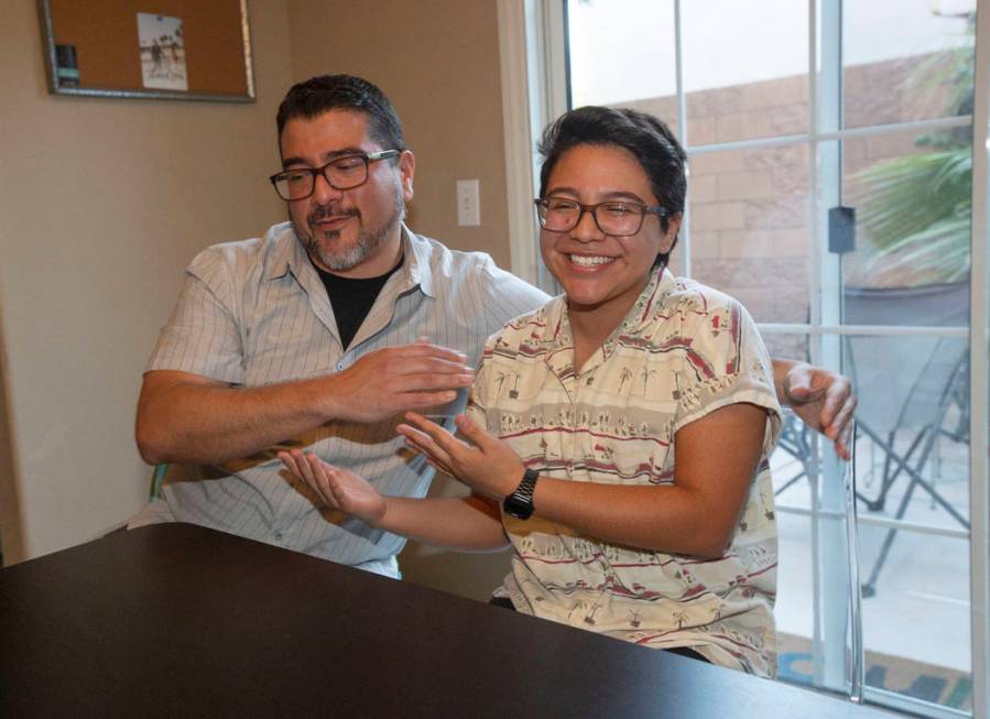 Albert Neavez and his son, Percy, reach in for a hug on July 1, 2019, in Henderson. (Michael Bl ...