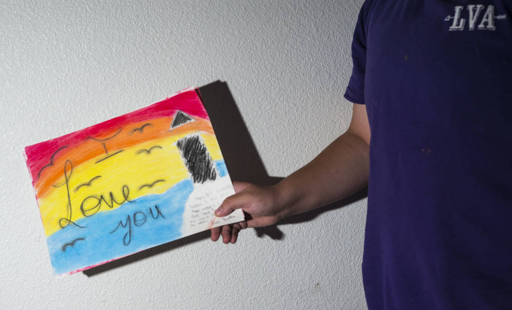 Fifteen-year-old Ryan Lauer shows artwork he made for his sister at home near downtown Las Vega ...