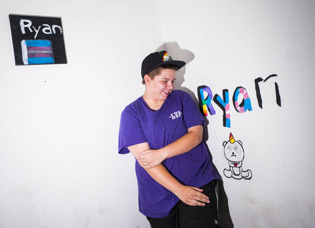 Fifteen-year-old Ryan Lauer poses with artwork at home near downtown Las Vegas on July 18, 2019 ...