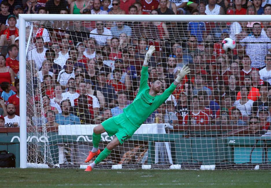 Liverpool goalie Andy Longergan is unable to make the save on a goal by Sevilla's Aguido Duran ...