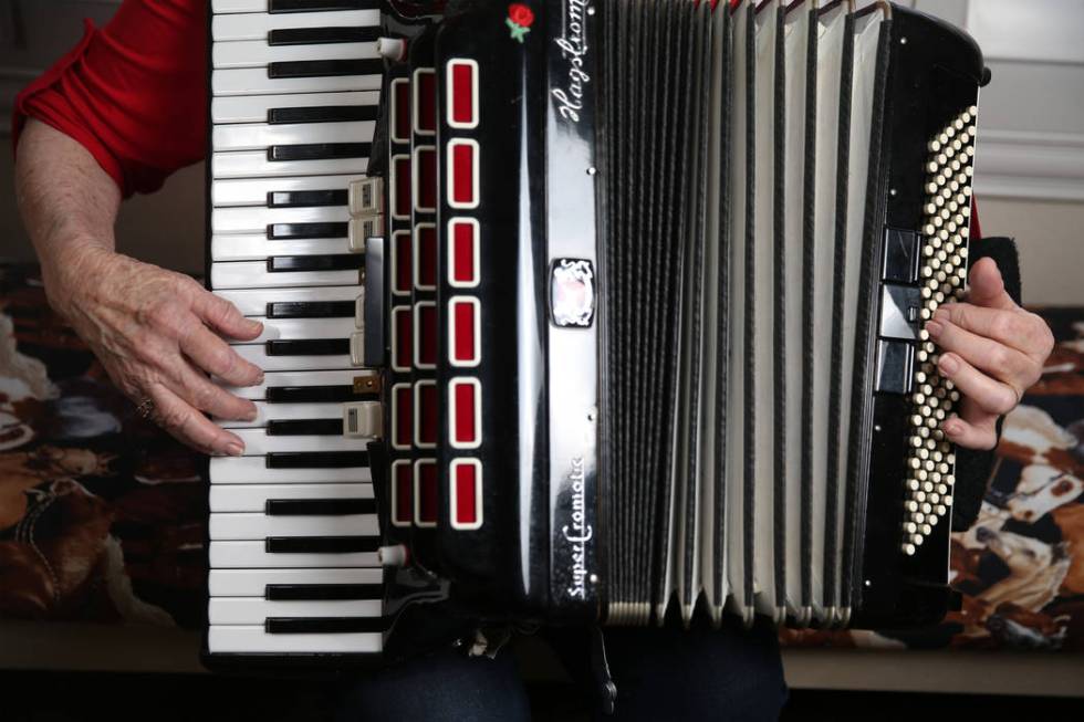 Etta Baykara, 91, plays accordion at her home in Las Vegas, Tuesday, July 30, 2019. Baykara wro ...