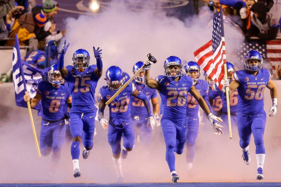 Boise State cornerback Avery Williams (26) carries the hammer as he leads Boise State on to the ...