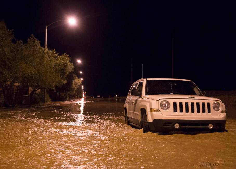 A vehicle is stuck in floodwaters at the intersection of West Fitzwilliam Avenue and South Fort ...