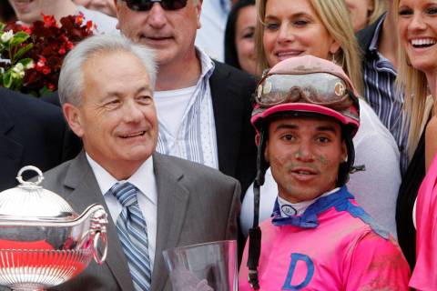 Jockey Joel Rosario, right, and trainer Jerry Hollendorfer pose with trophies after Rosario rod ...