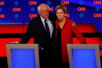 Sen. Bernie Sanders, I-Vt., and Sen. Elizabeth Warren, D-Mass., embrace after the first of two ...