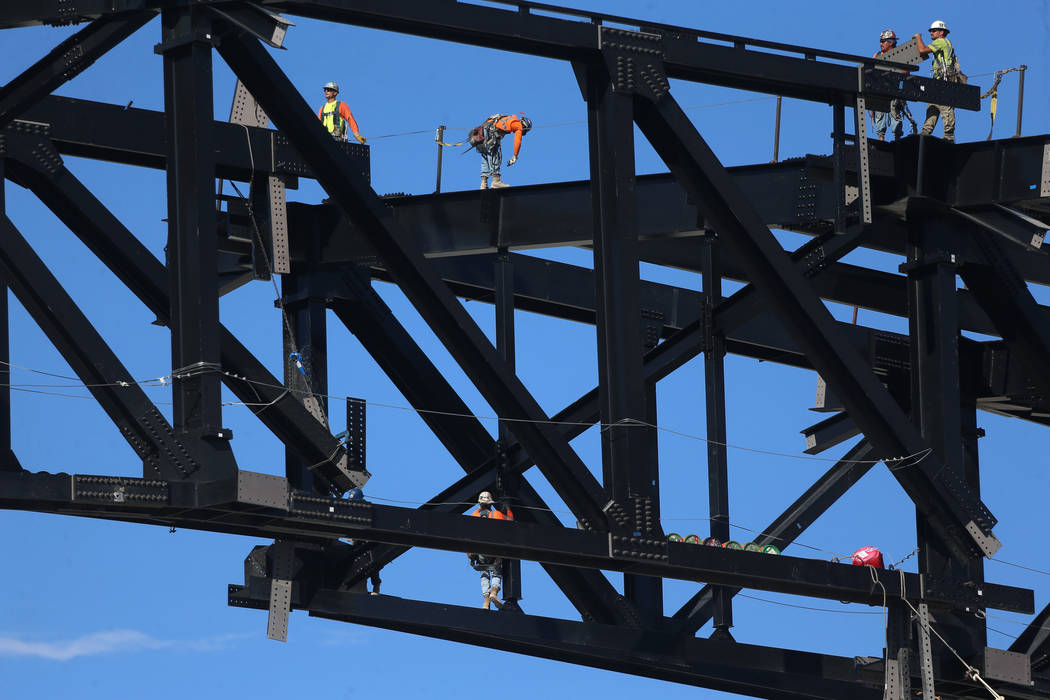 The final steel canopy truss goes up at the Raider stadium construction site in Las Vegas, Thur ...