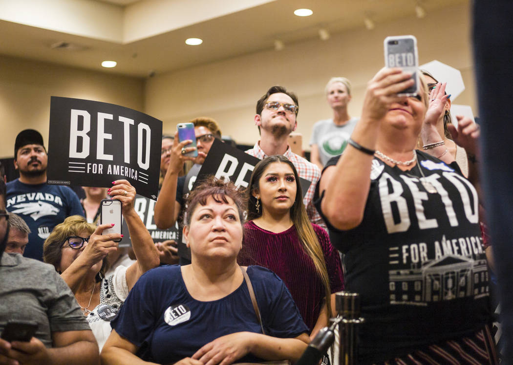 Attendees listen to Democratic presidential candidate and former Texas congressman Beto O'Rourk ...