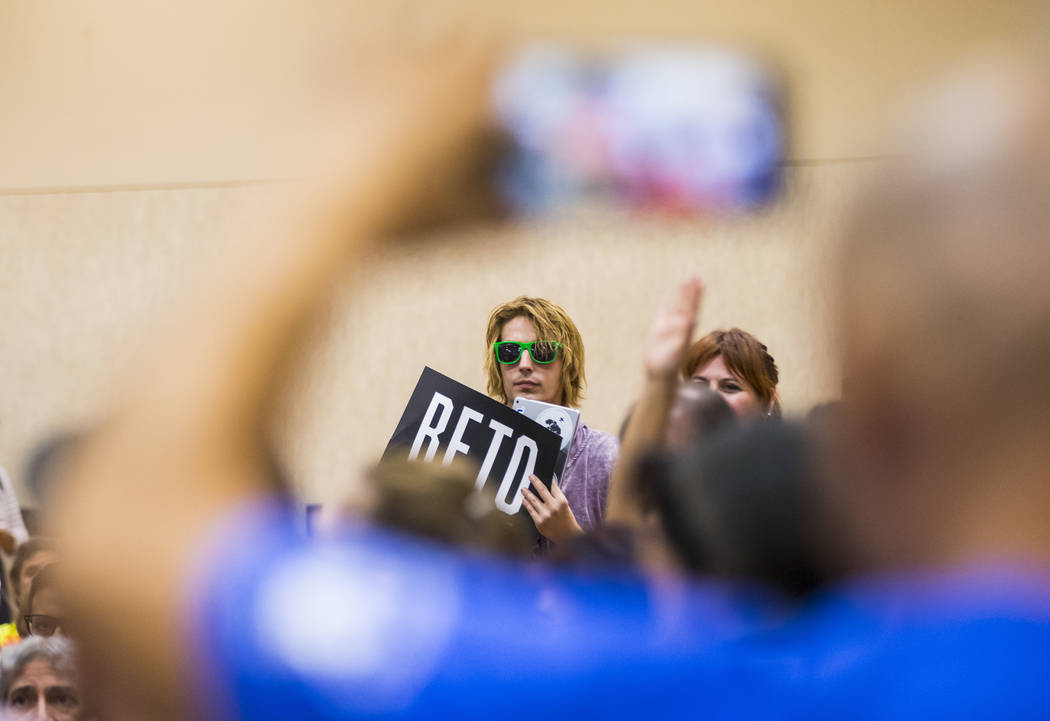 An attendee holds up a sign in support of Democratic presidential candidate and former Texas co ...