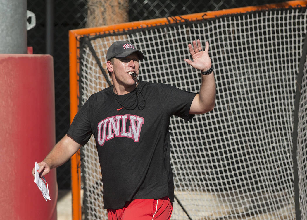 UNLV offensive coordinator Garin Justice coaches up the Rebels during the first day of training ...