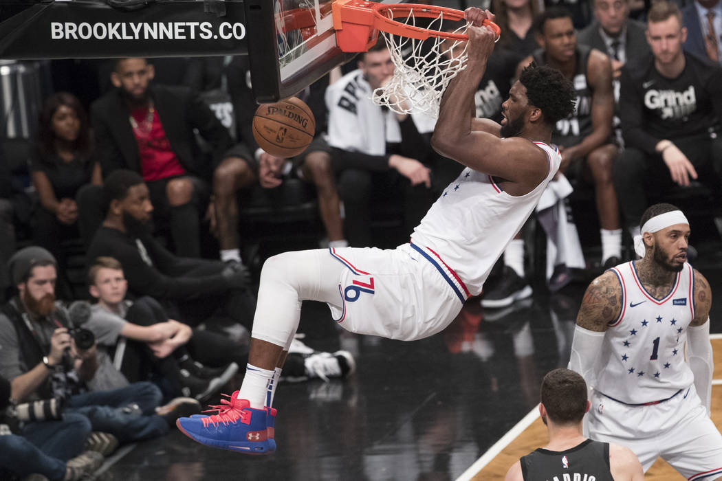 Philadelphia 76ers center Joel Embiid dunks during the second half of Game 4 of a first-round N ...