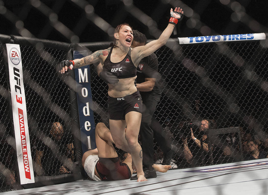 Cris "Cyborg" Justino celebrates after defending her featherweight title against Yana Kunitskay ...