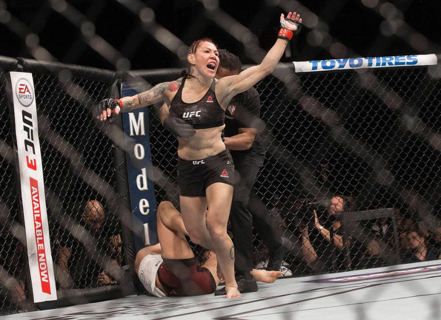 Cris "Cyborg" Justino celebrates after defending her featherweight title against Yana Kunitskay ...