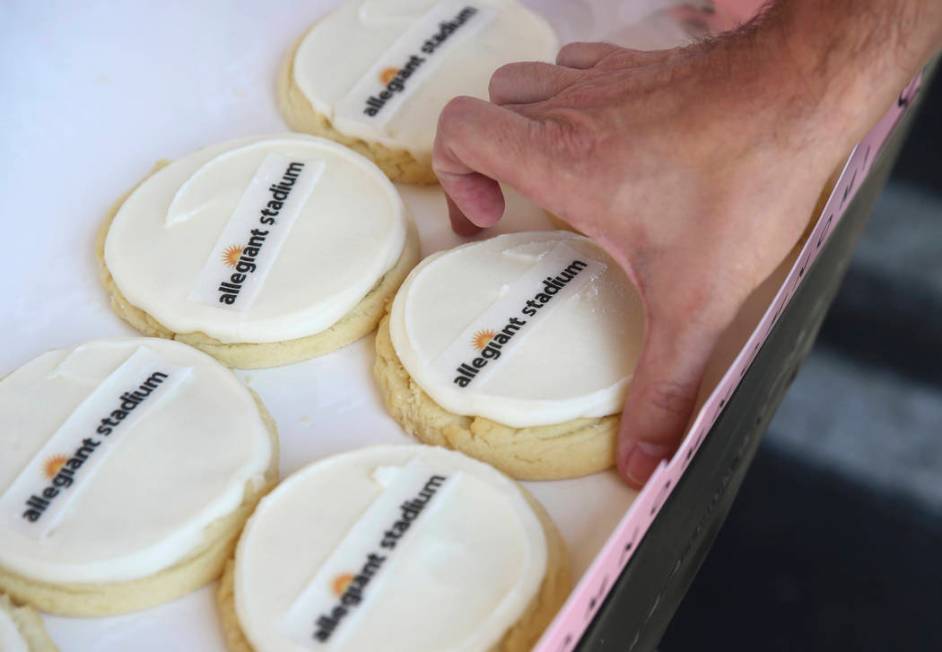 Allegiant Stadium branded cookies are given out to employees during an event to celebrate the n ...