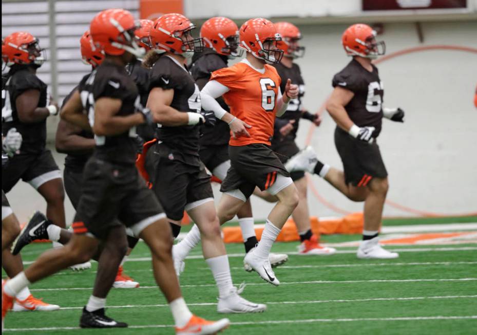 FILE - In this May 4, 2018, file photo, Cleveland Browns quarterback Baker Mayfield (6) runs a ...