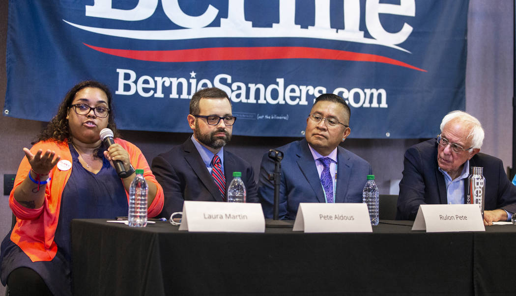Laura Martin, left, speaks on a panel led by Democratic presidential candidate Sen. Bernie Sand ...
