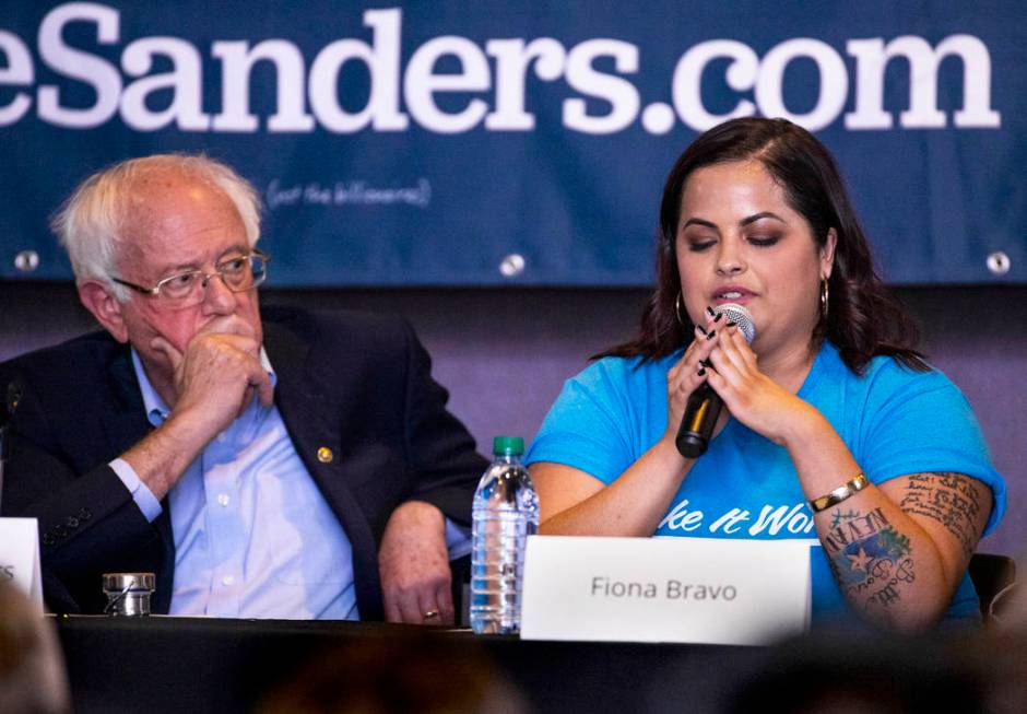Democratic presidential candidate Sen. Bernie Sanders, I-Vt., left, listens to panel member Fio ...