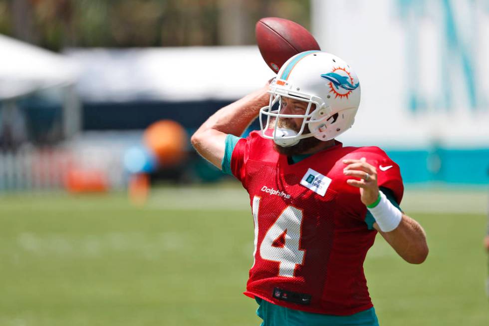 Miami Dolphins Miami Dolphins' Ryan Fitzpatrick passes as he runs drills at the teams NFL footb ...