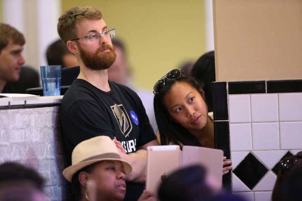 Attendees listen to Democratic presidential candidate former Vice President Joe Biden, out of f ...