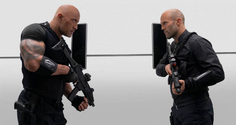 This image released by Universal Pictures shows Dwayne Johnson, left, and Jason Statham in a sc ...