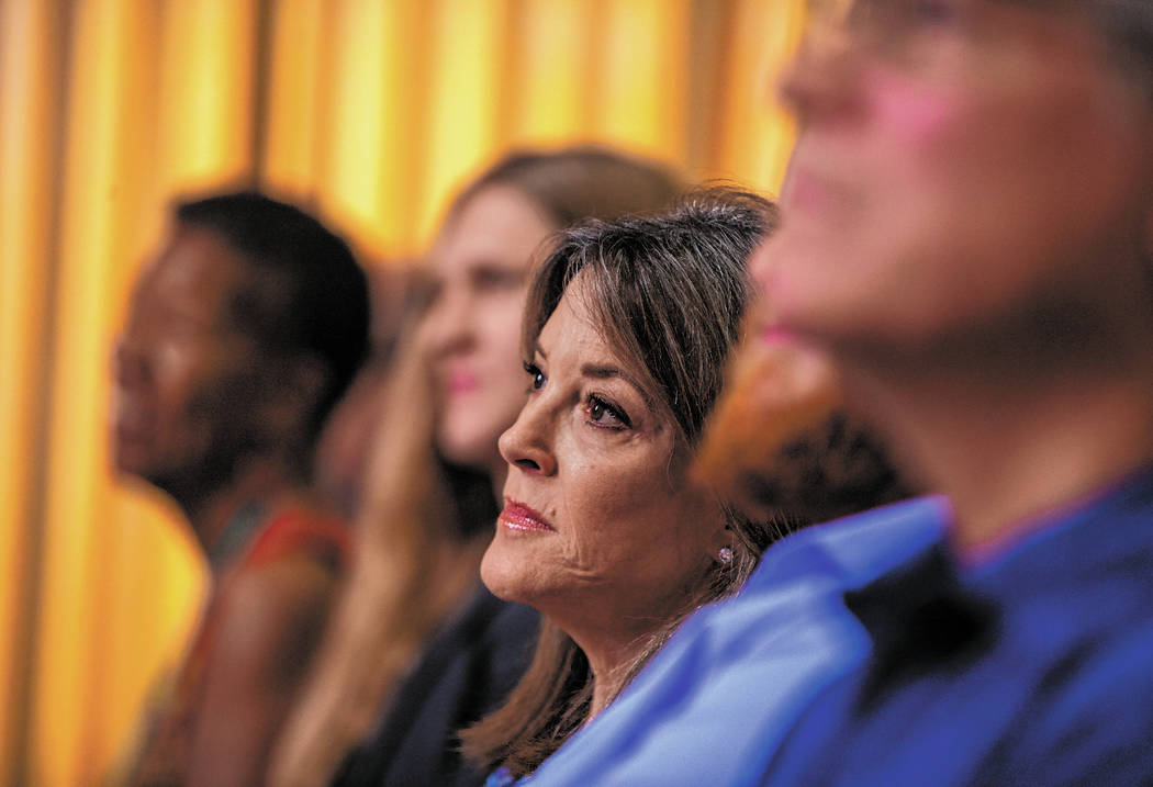 Democratic presidential candidate Marianne Williamson listens to her introduction as she will s ...