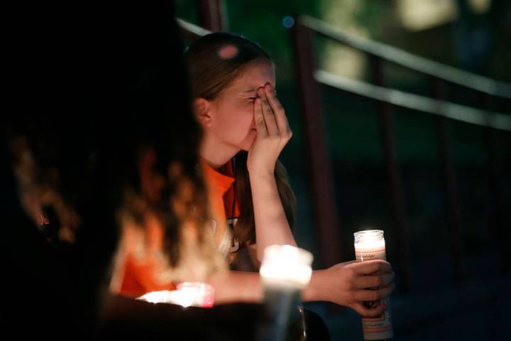 Sherie Gramlich reacts during a vigil for victims of a mass shooting that occurred earlier in t ...