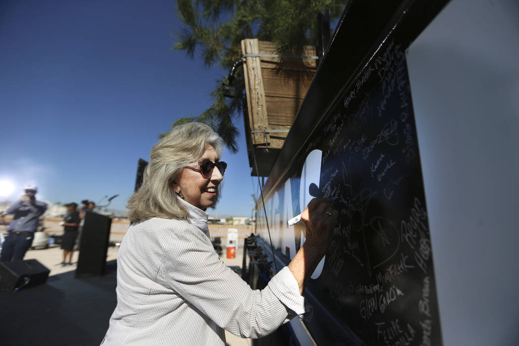 U.S. Rep. Dina Titus, D-Nev., signs a steel beam during the Las Vegas Stadium Topping Out Cerem ...