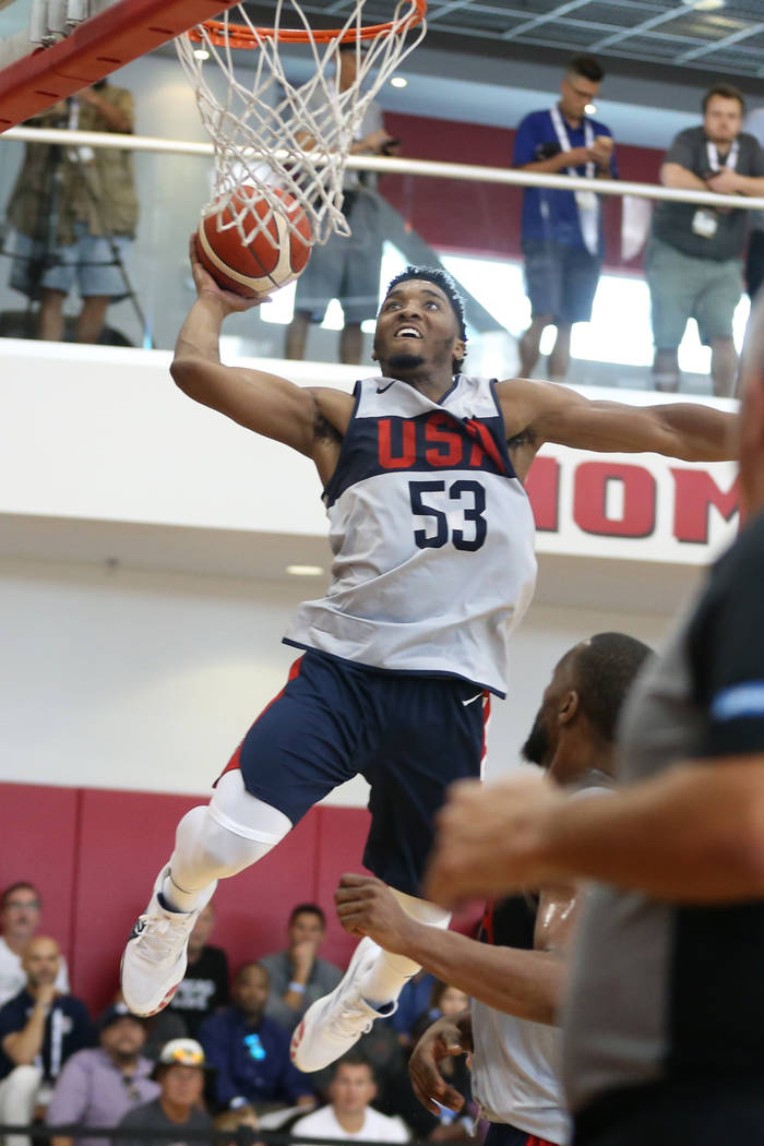 Utah Jazz guard Donovan Mitchell (53) goes up for a dunk during the Team USA training camp at U ...