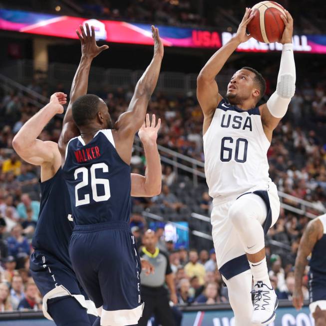 USA Men's National Team White guard Jalen Brunson (60) goes up for a shot under pressure from U ...