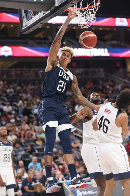 USA Men's National Team Blue forward Kyle Kuzma (21) dunks the ball under pressure from USA Men ...