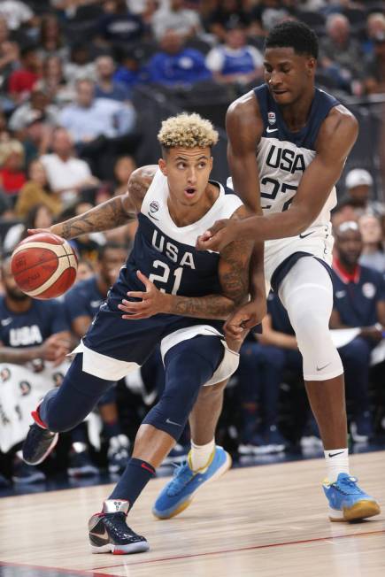 USA Men's National Team Blue forward Kyle Kuzma (21) looks to make a play under pressure from U ...
