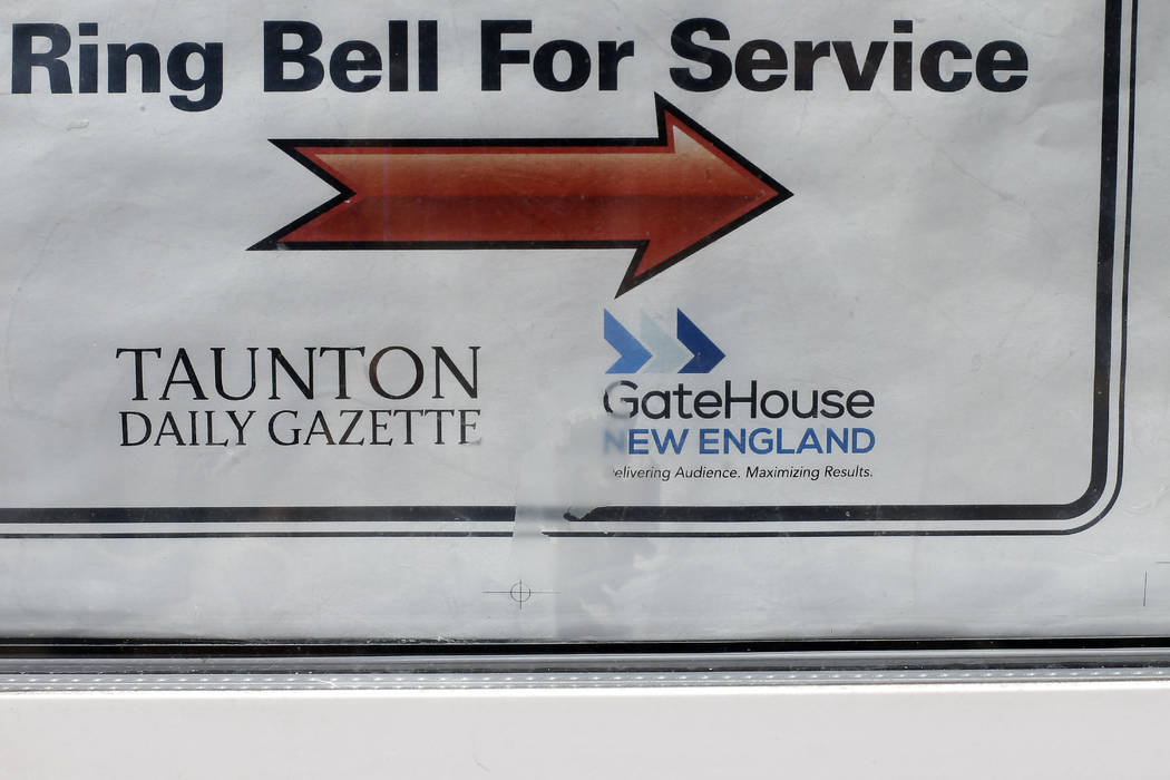 In this Monday, Aug. 5, 2019 photo a GateHouse New England logo appears on a door to the Taunto ...