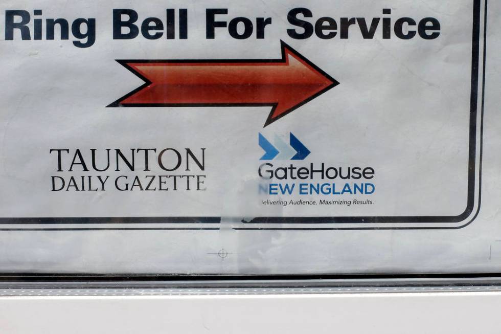 In this Monday, Aug. 5, 2019 photo a GateHouse New England logo appears on a door to the Taunto ...