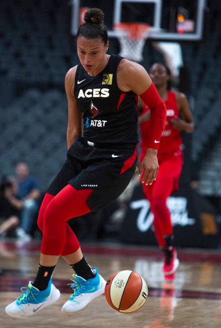 Las Vegas Aces guard Kayla McBride (21), does a crossover against Washington Mystics players at ...