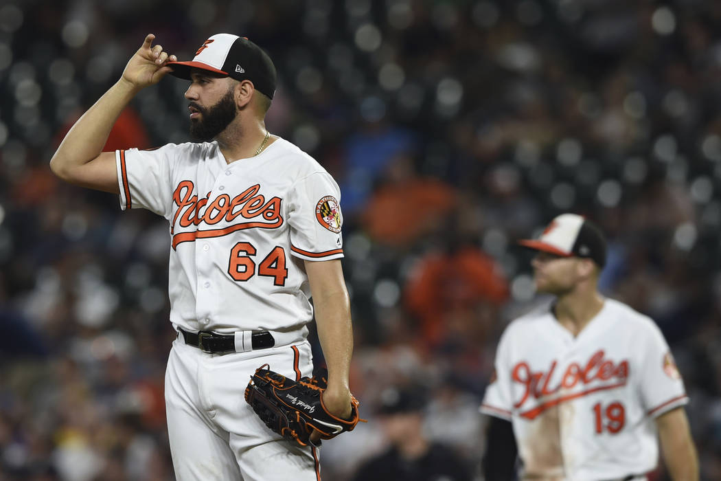 Baltimore Orioles pitcher Gabriel Ynoa looks to the outfield after giving up three runs to the ...