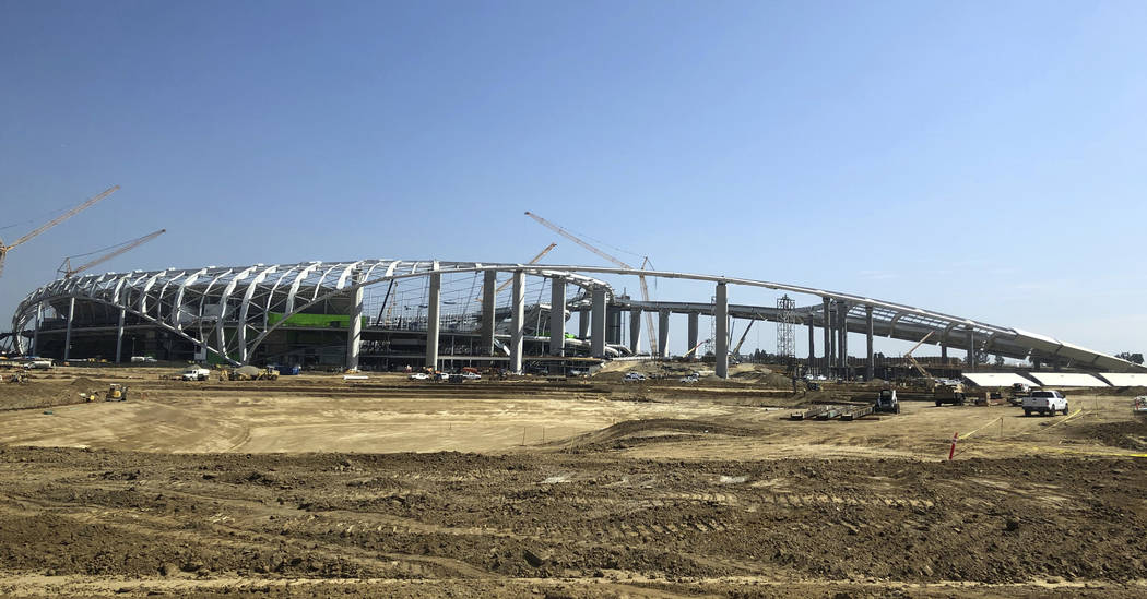 The exterior of the football stadium under construction in Inglewood, Calif., Tuesday, July 30, ...