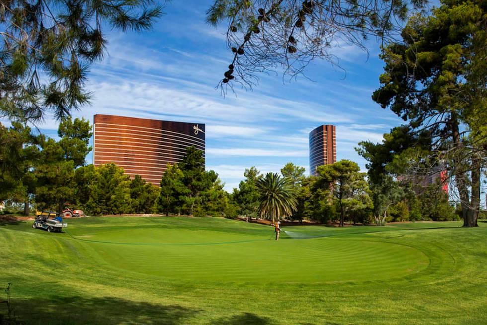 Maintenance crew water the 14th green at Wynn Golf Club on Tuesday, July 30, 2019, in Las Vegas ...